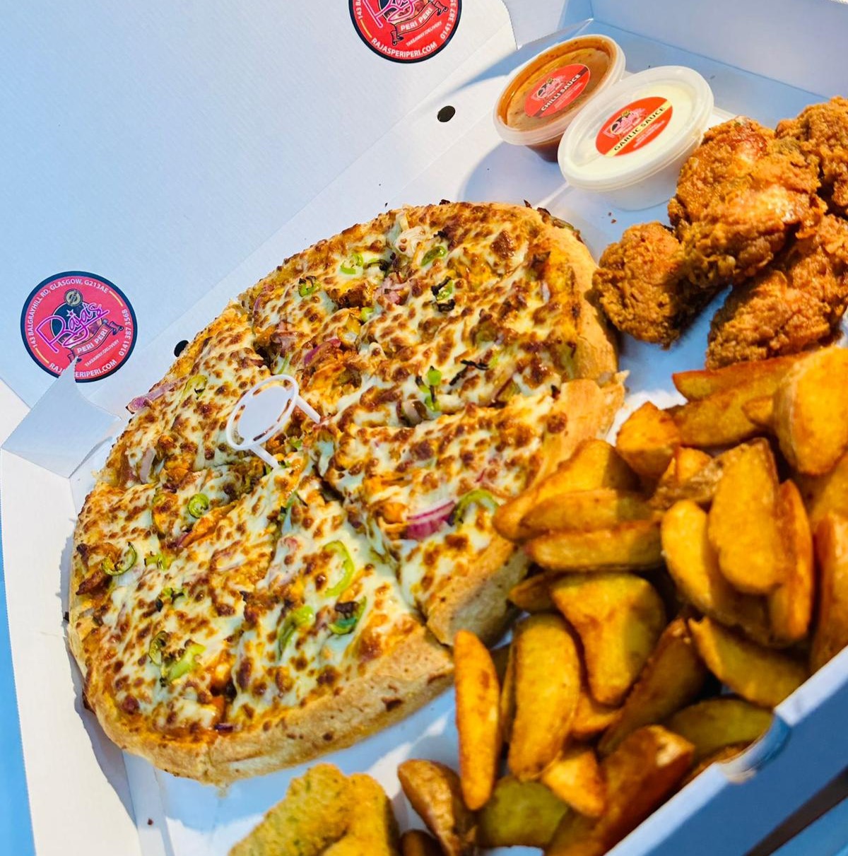 a fresh pizza served at Raja's Peri Peri Takeaway in Glasgow